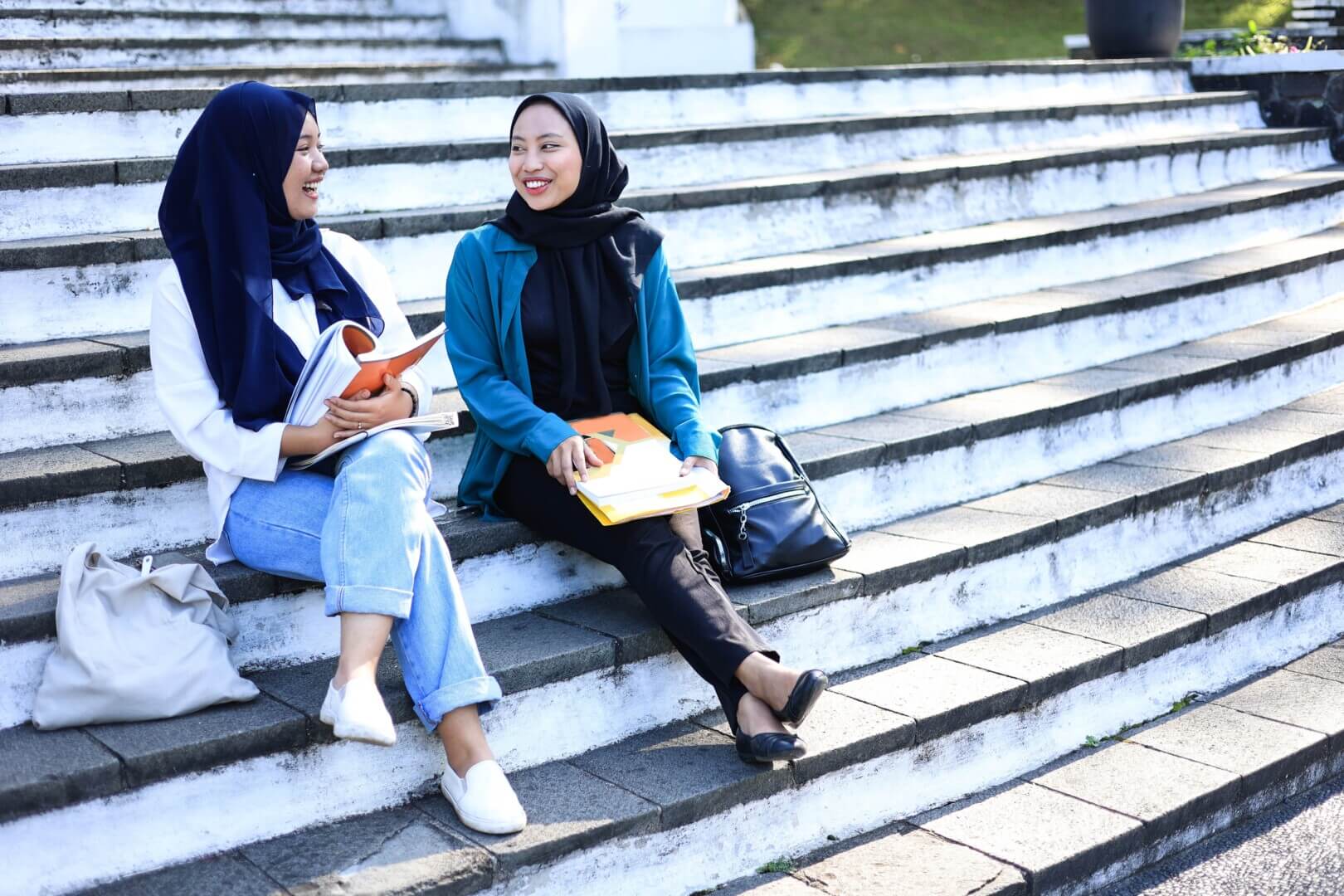 two,female,mosleem,indonesian,college,student,smiling,and,talking,to